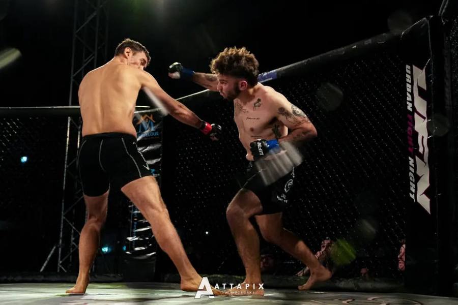 Riley Kerr's athlete Aaron Curry competing in an MMA cage fight
