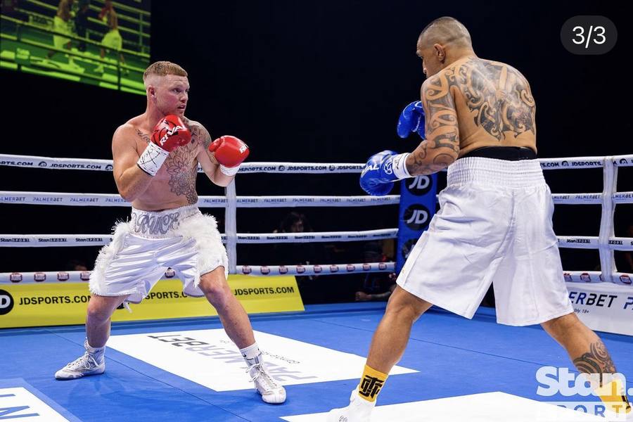 Riley Kerr's athlete Travis Druce boxing in a professional bout